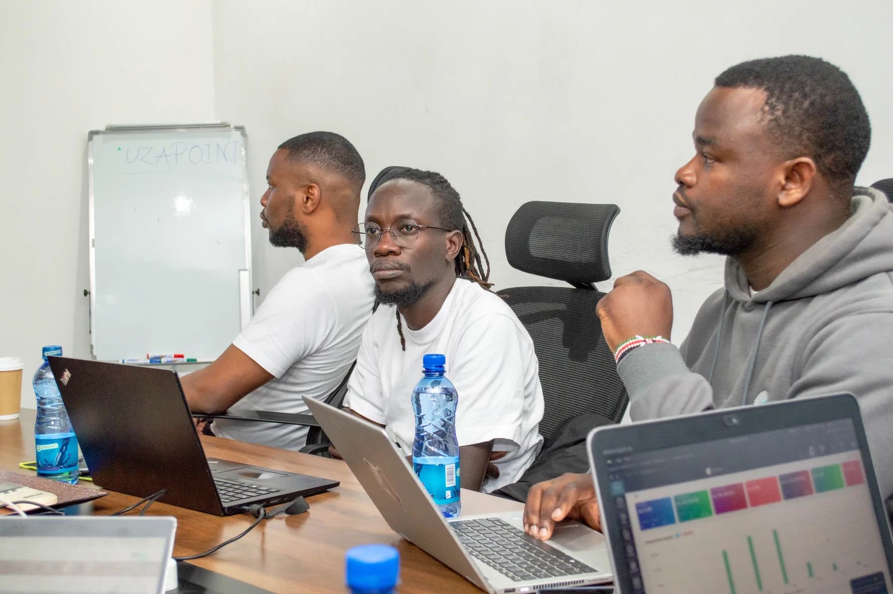 Attendees networking during an Uzapoint event