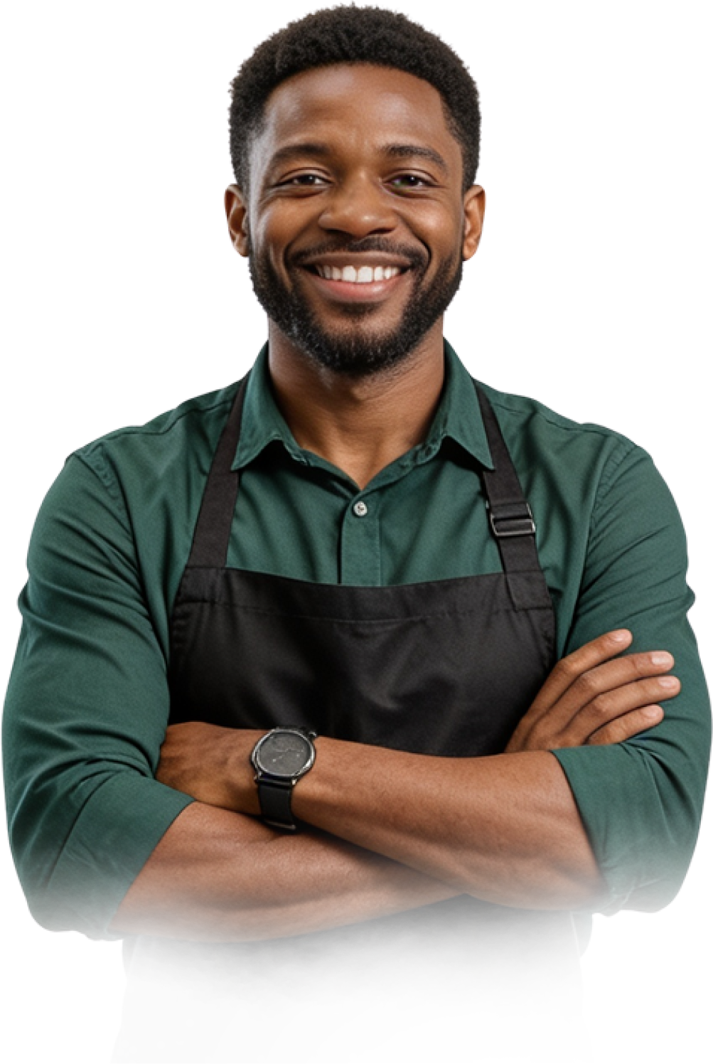 Smiling young African business owner in a green shirt and black apron
